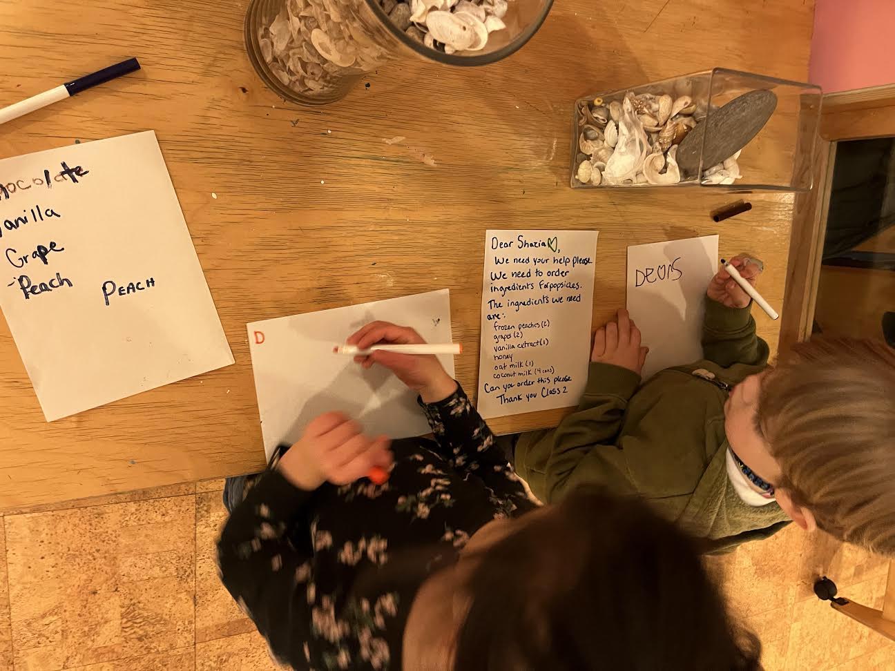 children writing notes