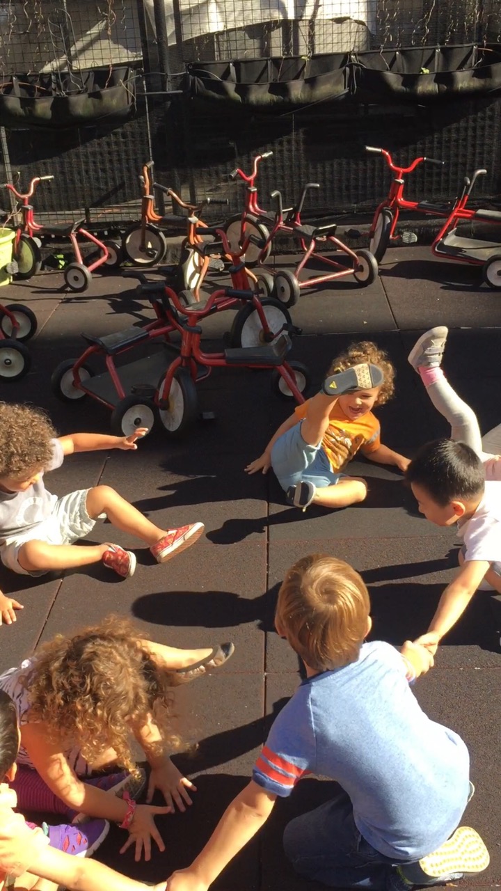 children stretching outside
