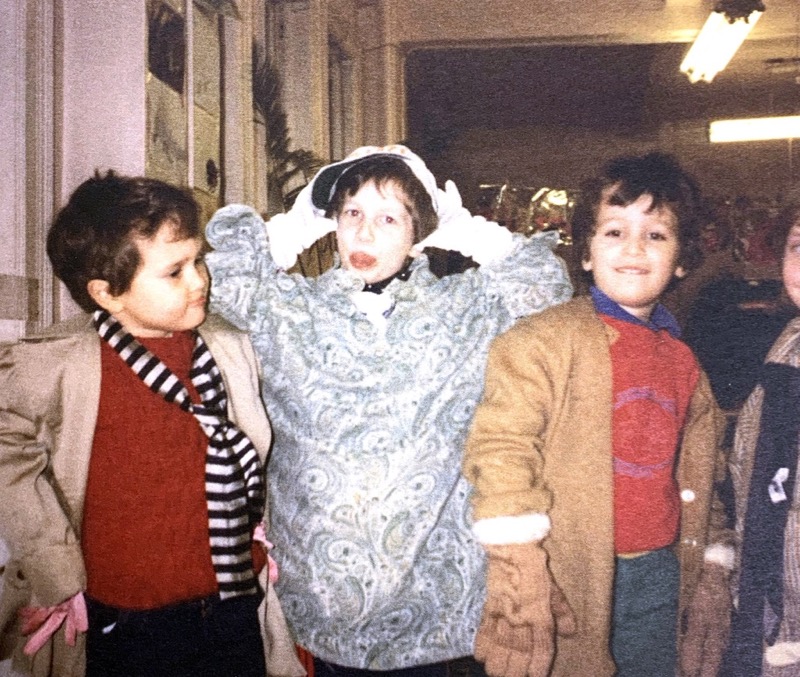 three children one making a silly face