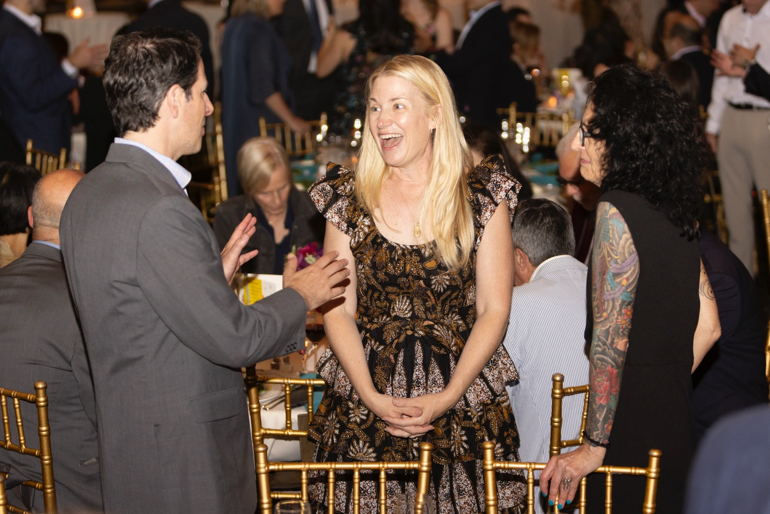 parents talking at a fancy event